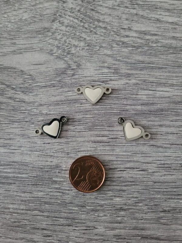 Zilverkleurige/witte bedel in de vorm van een hart 2