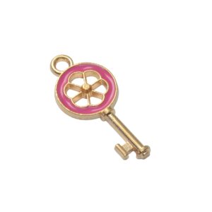 Goudkleurige/roze bedel – sleutel